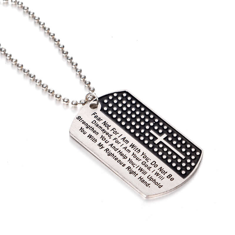Close-up of the stainless steel dog tag necklace showing its geometric design