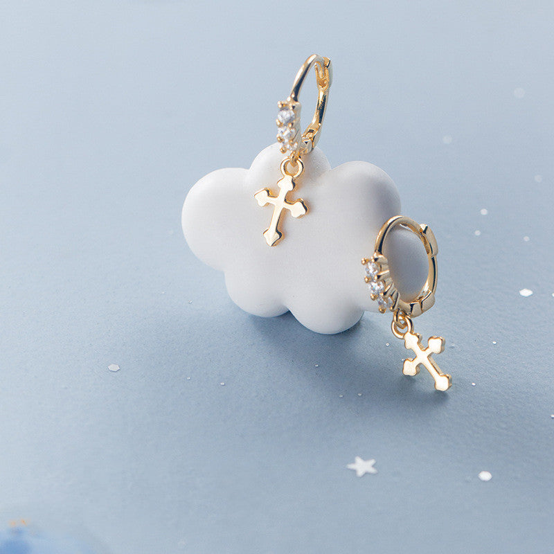 Glossy Cross Earrings displayed on a cloud-shaped background, reflecting elegance and Christian faith.