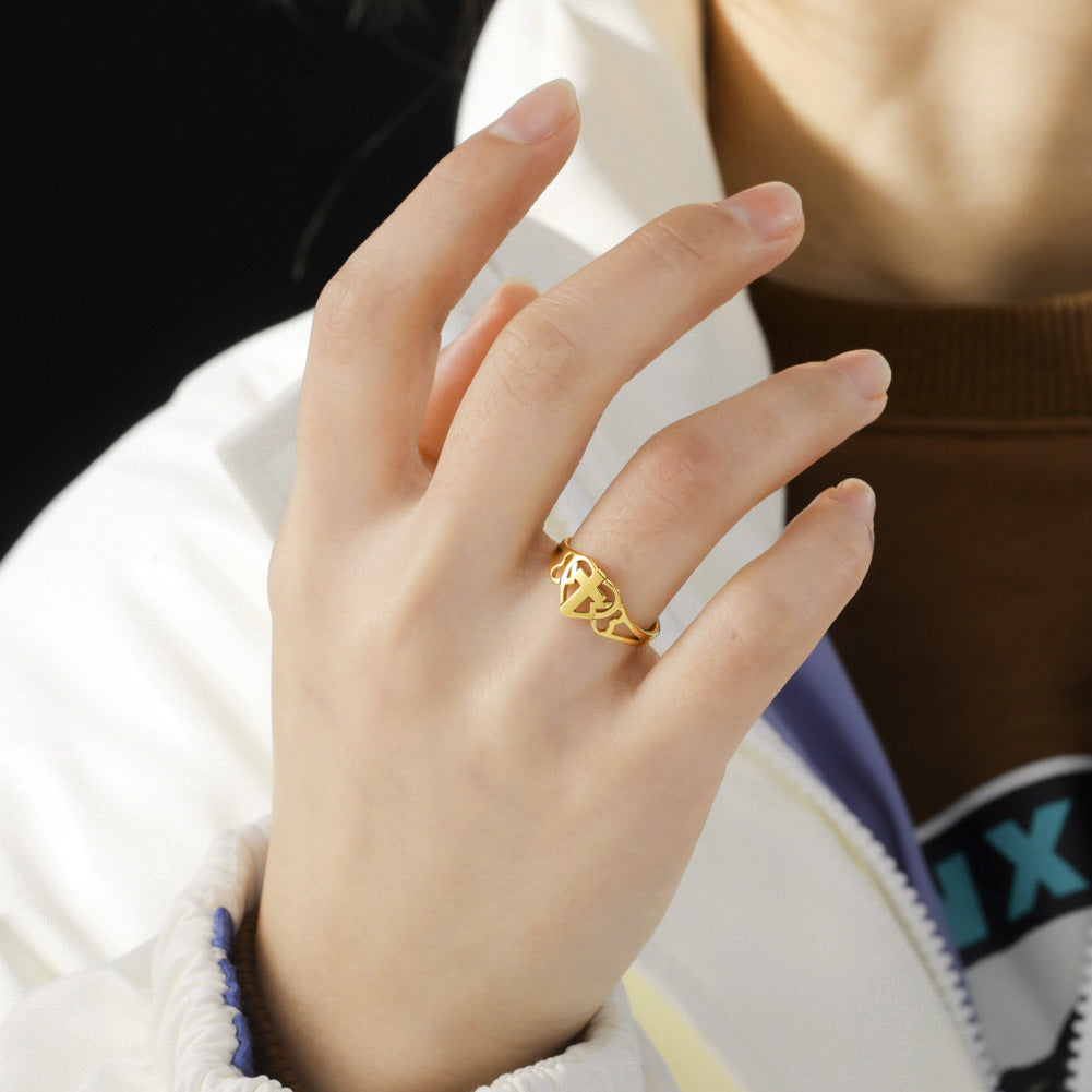 Stainless Steel Love Cross Ring worn on a hand, showcasing minimalist Christian faith jewelry design.