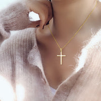 Sterling Silver Cross Pendant Necklace worn by model with soft sweater, symbolizing faith and elegance.