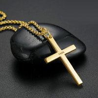 Sterling Silver Cross Pendant Necklace on a black stone background, showcasing elegant faith jewelry.